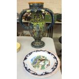 A majolica puzzle jug, (a/f), 42cm high and four ceramic plates, (5).