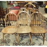 Three Ercol hoop spindle-back chairs, two others and a light-wood valet.