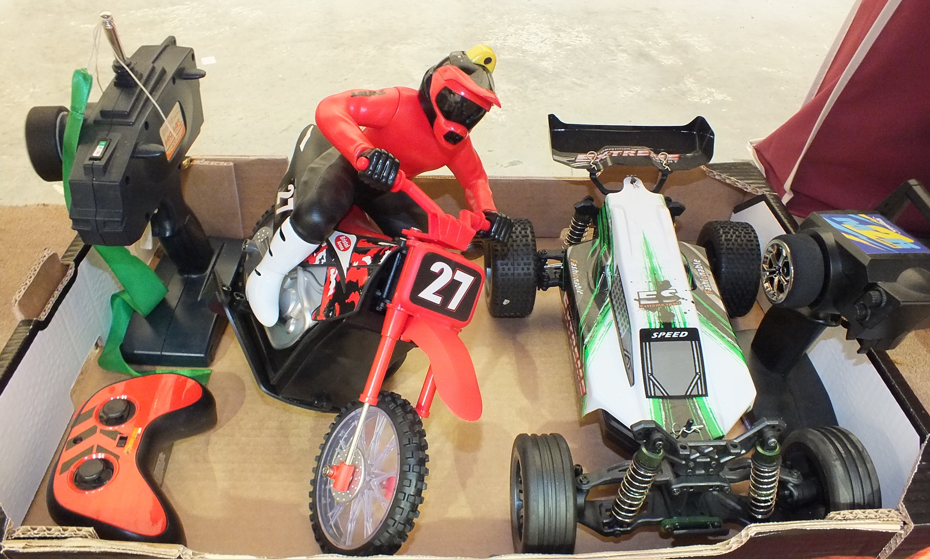 A battery-powered remote-control motorcycle and controller and a RipMax remote-control racing car