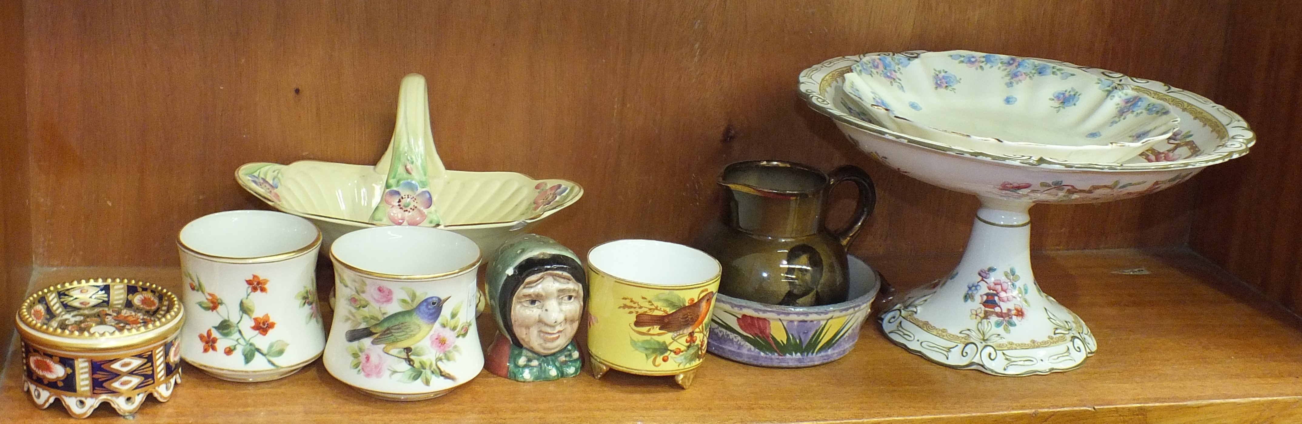 Three Royal Worcester pots painted with birds, 7cm high and other ceramics.