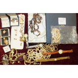 A quantity of costume jewellery and watches.