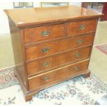 A reproduction burr walnut straight-front chest of two short and three long drawers, 98cm wide.
