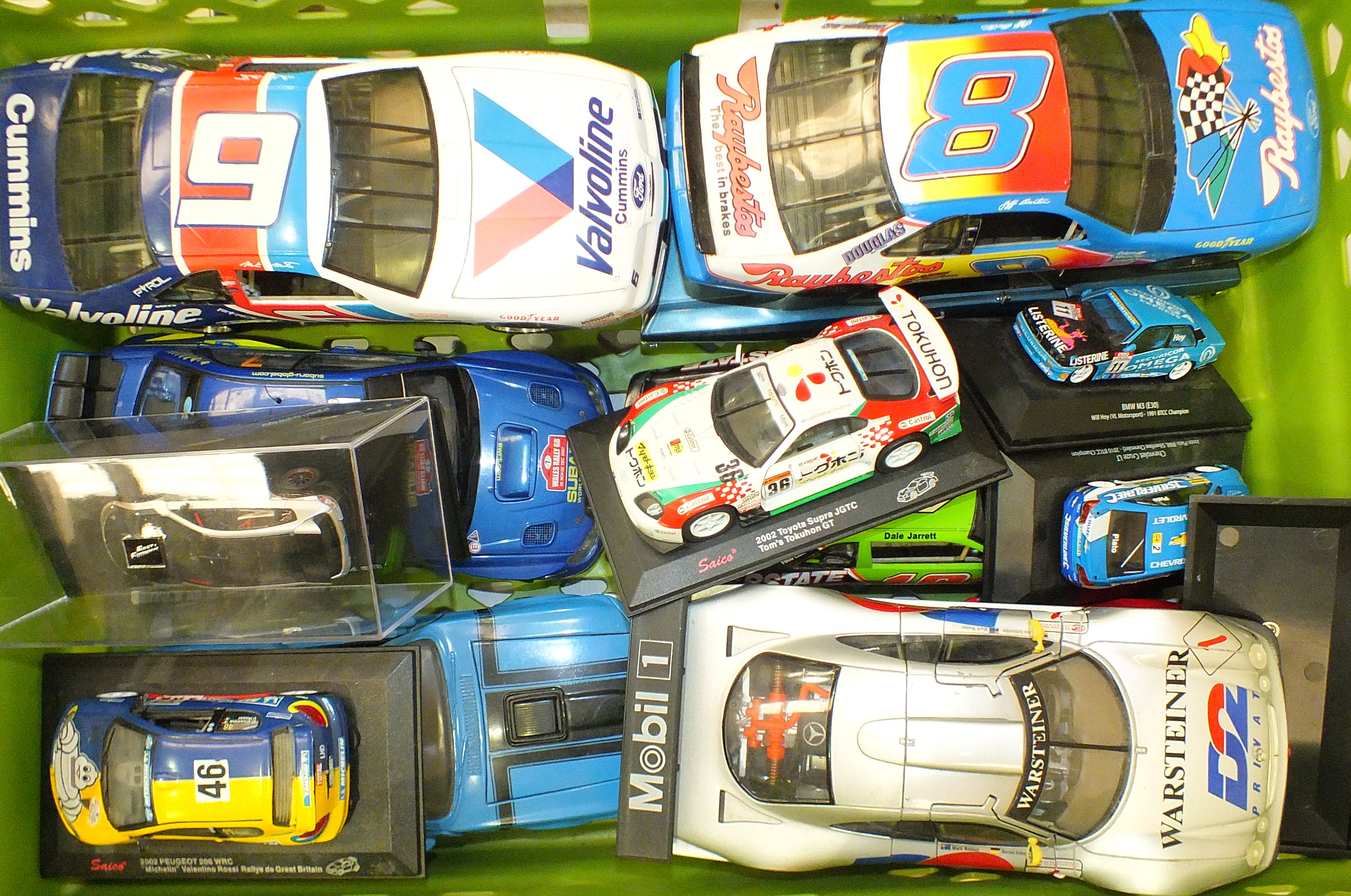 A collection of unboxed Ertl, Maisto and other scale model racing cars, various scales, (14).