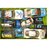 A collection of unboxed Ertl, Maisto and other scale model racing cars, various scales, (14).
