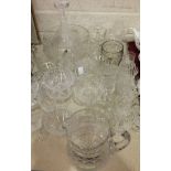 A collection of cut-glass sundae dishes, a cut-glass water jug and other glassware.
