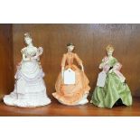A Royal Worcester figurine 'First Dance', modelled by F C Doughty and two others, 'Charity' and '