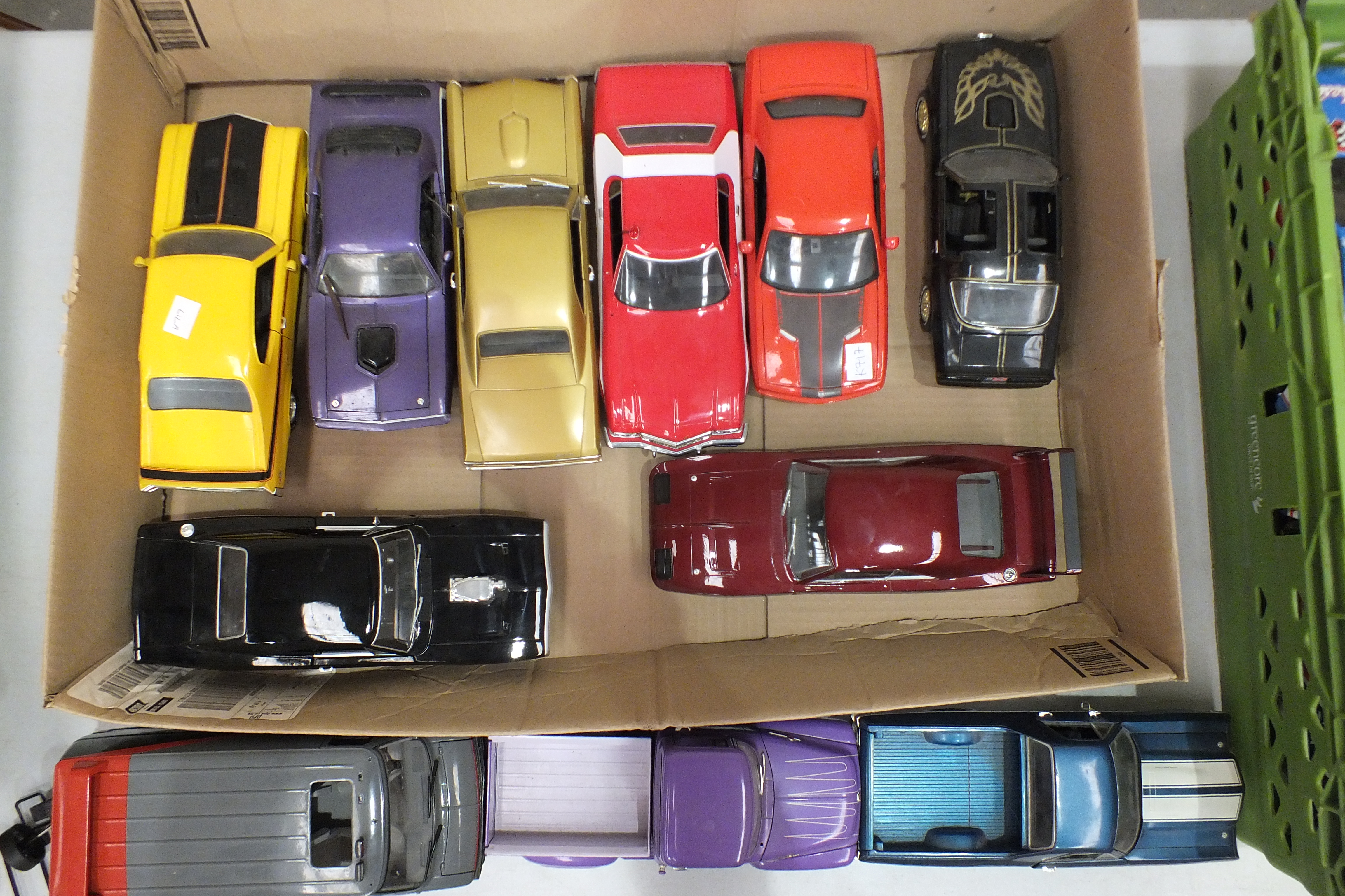 A collection of eleven unboxed mainly 1960's model cars, 1/18th and other scales, (11).