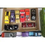 A collection of eleven unboxed mainly 1960's model cars, 1/18th and other scales, (11).