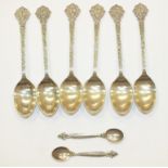 A pair of Georg Jensen silver salt spoons and a set of six silver teaspoons with Celtic