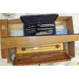 A boxwood and lacquered brass rolling ruler by Harling of London, in fitted box, a collection of