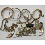Two gold-plated silver hinged bangles, two silver ingots and other items.