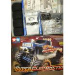 A Tamiya "Super Clod Buster" 1/10th scale R/C 4x4x4 pick-up truck, boxed, (unused).