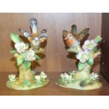 A Crown Staffordshire ceramic Chaffinch with wings outstretched, on branch, 13cm high and another.