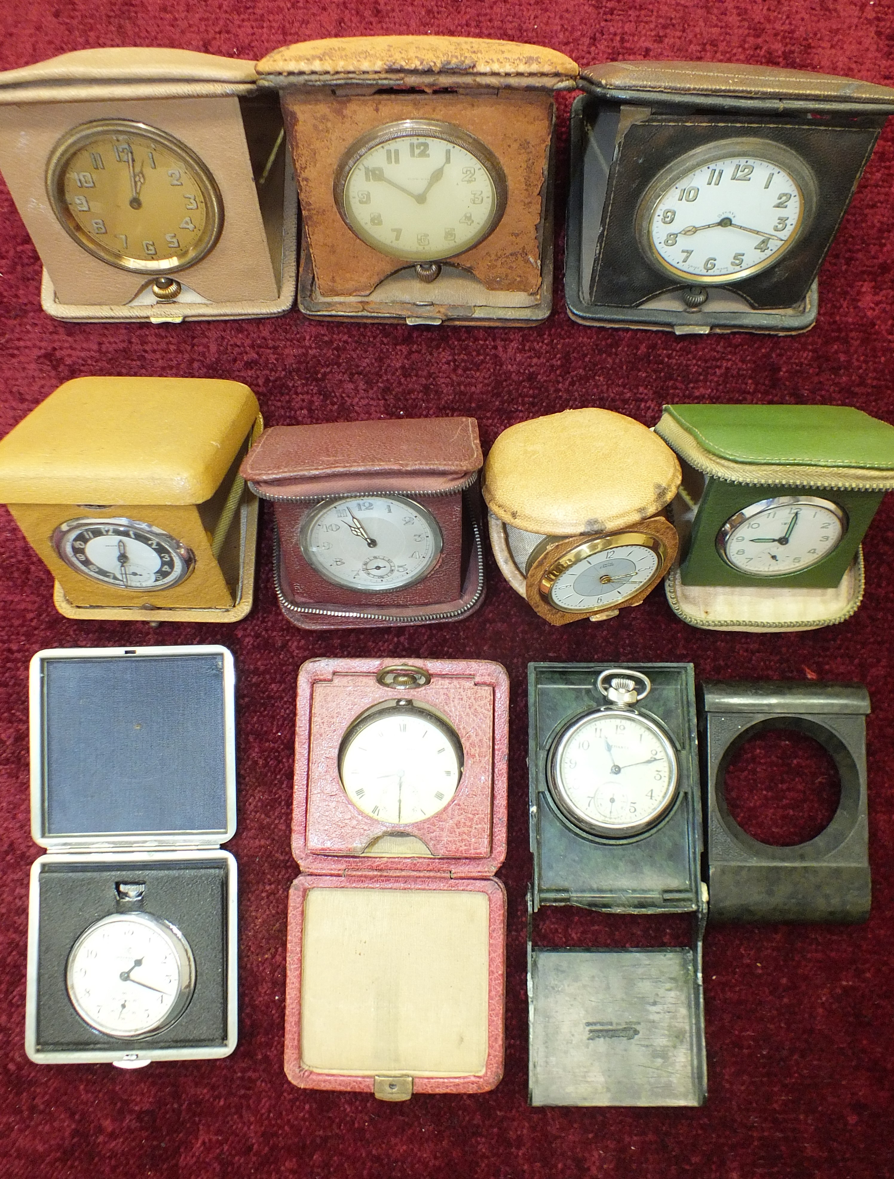 An 8-day travelling clock, (a/f) and nine similar clocks and watches, (10).