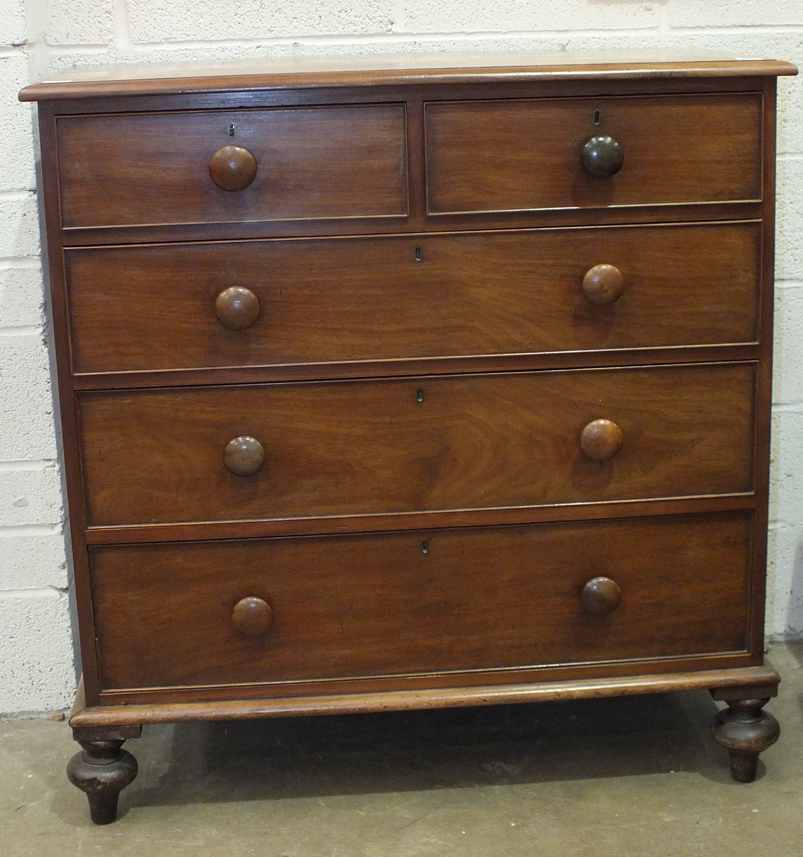 A Victorian chest of two short and three long cockbeaded drawers, on turned legs, 108cm wide,