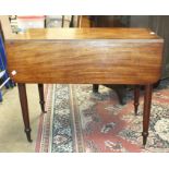 An early-19th century mahogany drop-leaf Pembroke table with single frieze drawer, on turned legs,