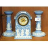A Wedgwood blue and white jasperware timepiece decorated with the 'Three Muses', 16.5cm high and a