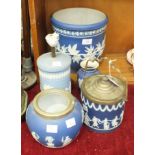 A Tunstall Adams blue and white jasperware biscuit barrel decorated with garlands and dancing