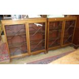 A pair of mahogany glazed floor-standing bookcases, each with a pair of astragal-glazed doors, on