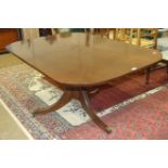 An early-19th century mahogany breakfast table, the rectangular top with rounded corners, on