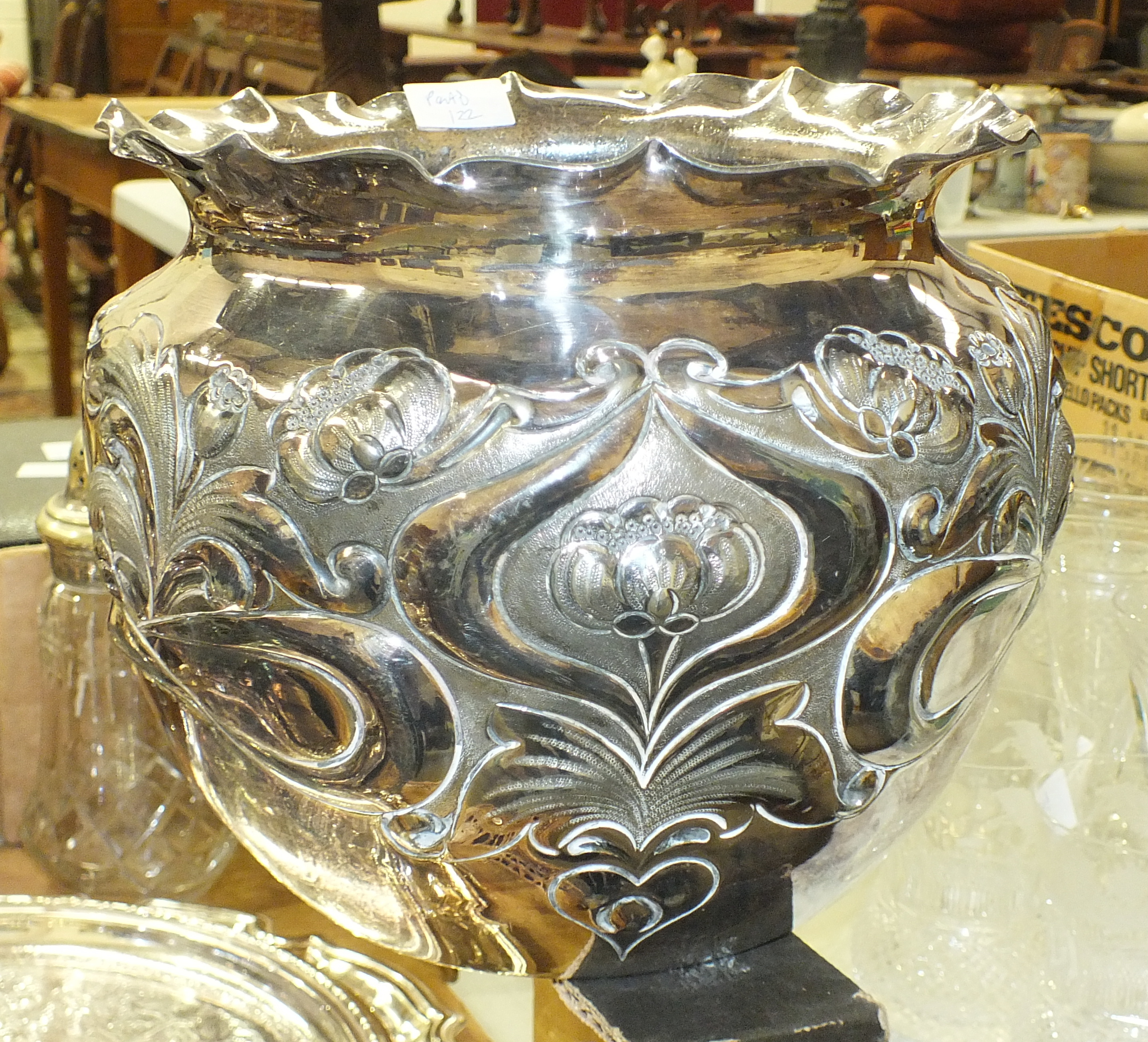 A plated jardinière in the Art Nouveau style, with embossed floral decoration, 18cm high, 20cm