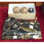 A black and pale streaked marble desk set, 31cm and three carpet bowls, (4).