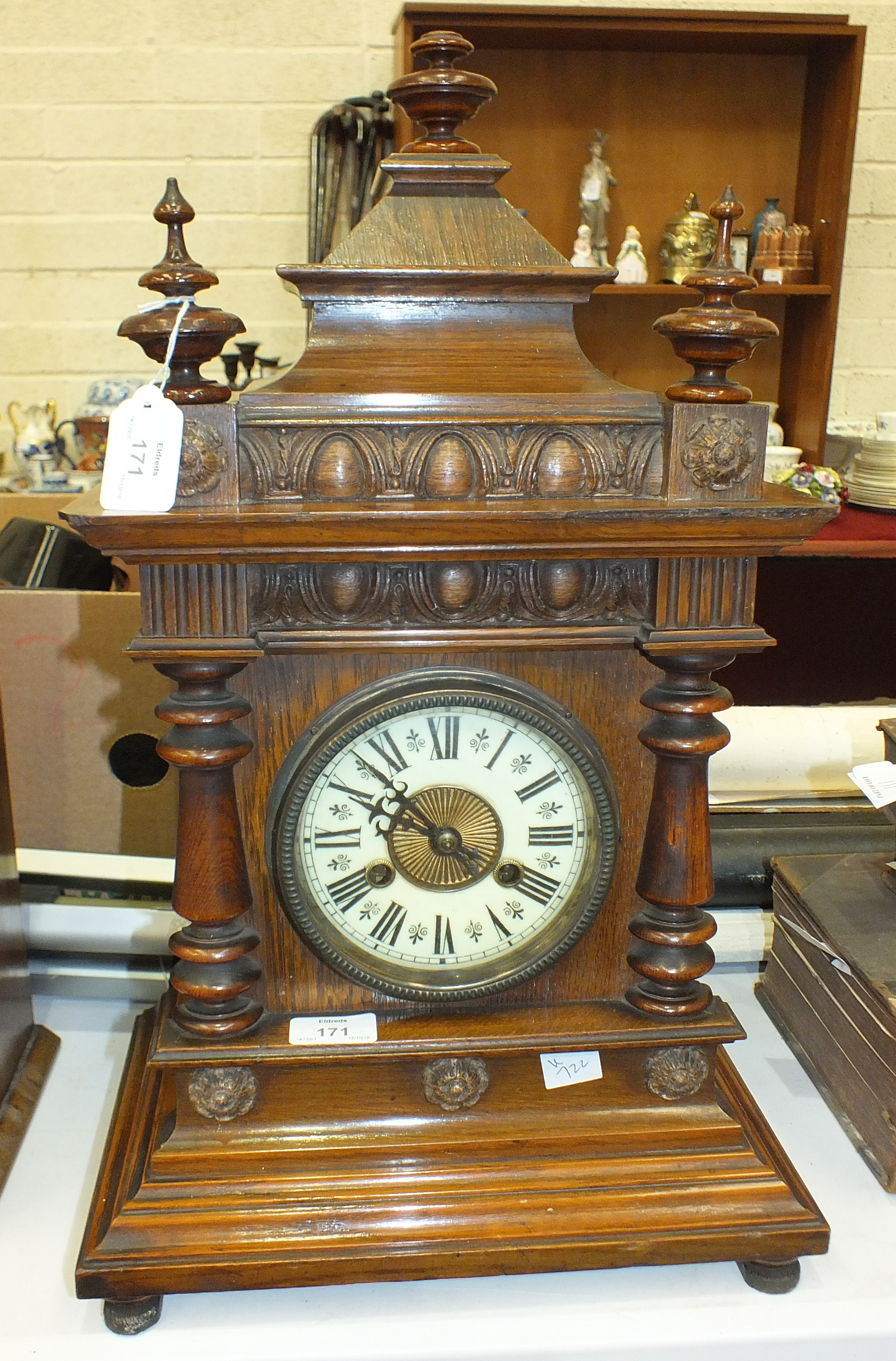 A late-19th century walnut-cased striking mantel clock, 56cm high.