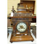 A late-19th century walnut-cased striking mantel clock, 56cm high.