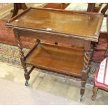 An oak tea trolley with fold-over card table top, an Edwardian inlaid mahogany nursing chair and a