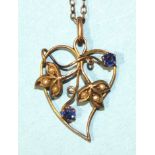 An Edwardian open-work heart-shaped pendant set seed pearls and blue paste stones, a modern 9ct gold