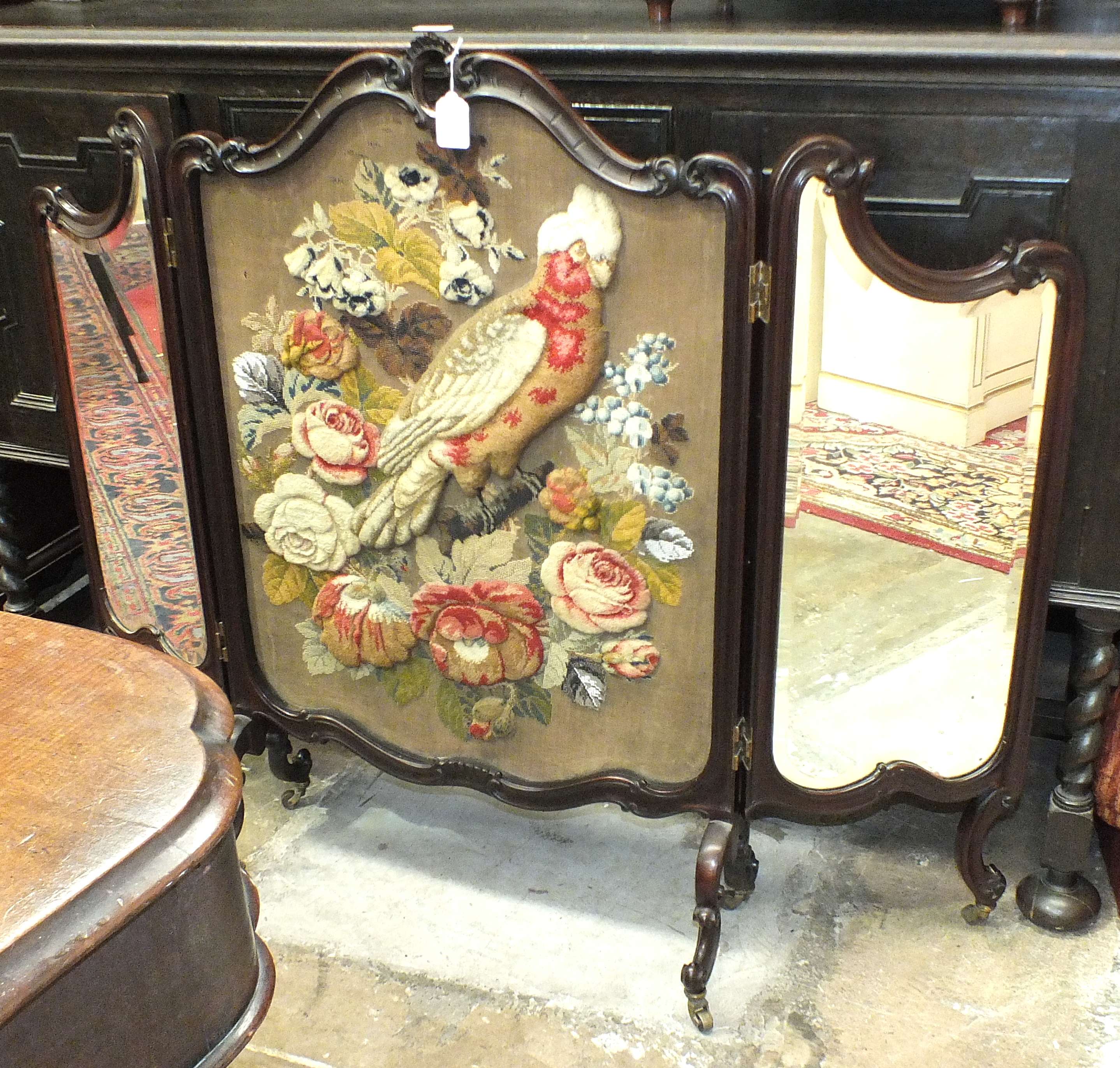 An early-20th century triptych fire screen, the central panel decorated with a needlework and bead - Image 2 of 2