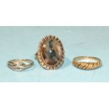 A 9ct gold knot ring set diamond points, size J, 1.9g, a 9ct gold rope-twist ring, size O½, 2.1g and