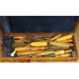 A large collection of woodworking, turning and carving chisels.