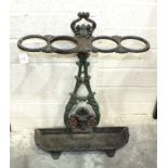 A cast iron stick stand with drip tray, 69cm high.