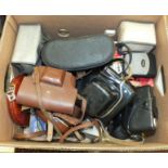 A pair of Chinon 10x50 binoculars in case and a collection of various cameras, including Praktica,