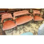 An Edwardian walnut-framed lounge suite, comprising a two-seater settee with upholstered back,