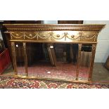 A gilt-painted over-mantel mirror fitted with three bevelled plates, 83 x 130cm.