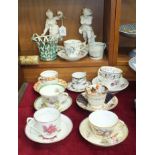 A 19th century Continental tea cup and saucer decorated with birds and flowers, a Royal Worcester