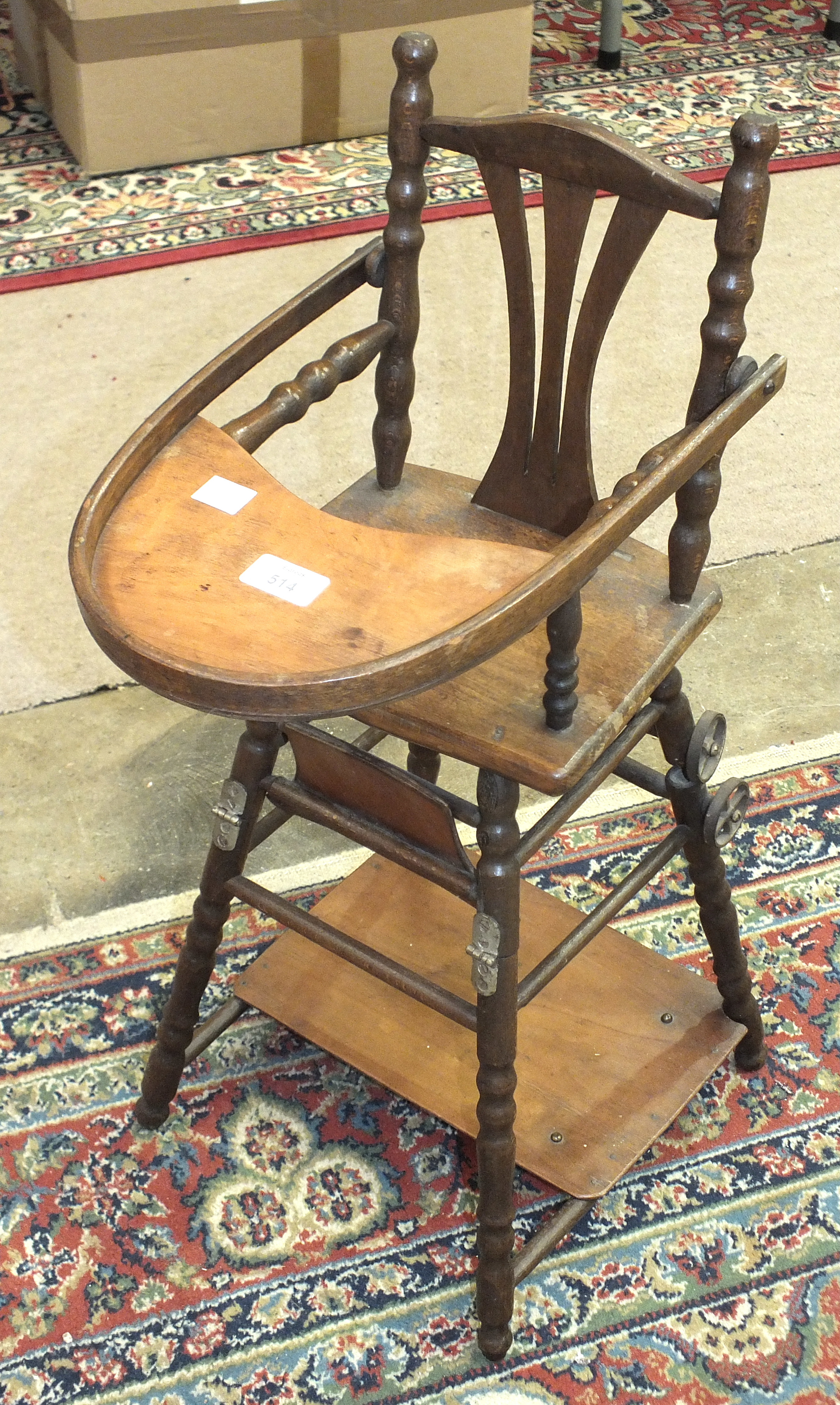 A doll's metamorphic high chair, a turned wood cot with mattress, 62cm long, 64cm high and a child's