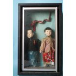 A pair of Chinese dolls of padded wood and papier-mâché construction, a boy and a girl, in later