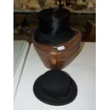A Dunn & Co. top hat, approximate size 7, in a Victorian fitted leather hat box, (damage to