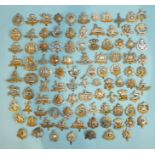 A collection of one hundred various military badges, (100).