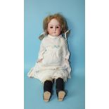 An Armand Marseille "Mabel" bisque shoulder head doll with sleeping brown eyes, open mouth and