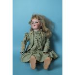 A C M Bergmann bisque head doll with sleeping blue eyes and blonde wig, on jointed composition body,