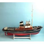 A kit-built radio-controlled model of 'Bugsier 3' (Hamburg tug), 83cm long, (a/f), on stand.