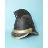 A Jas Henbry Ltd of Glasgow leather fire helmet with metal rim, c1900.