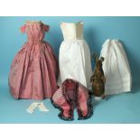 A Victorian doll's silk dress c1840's, of pink striped silk with boned bodice, lace trimming and