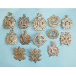 A collection of thirteen Scottish regiment badges, including Glasgow Highlanders 5th VB HLI, Lovat's