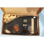 A German Auto-Harp, boxed, with original label "Deutsche Waren Abnahmegesellschaft MBH".