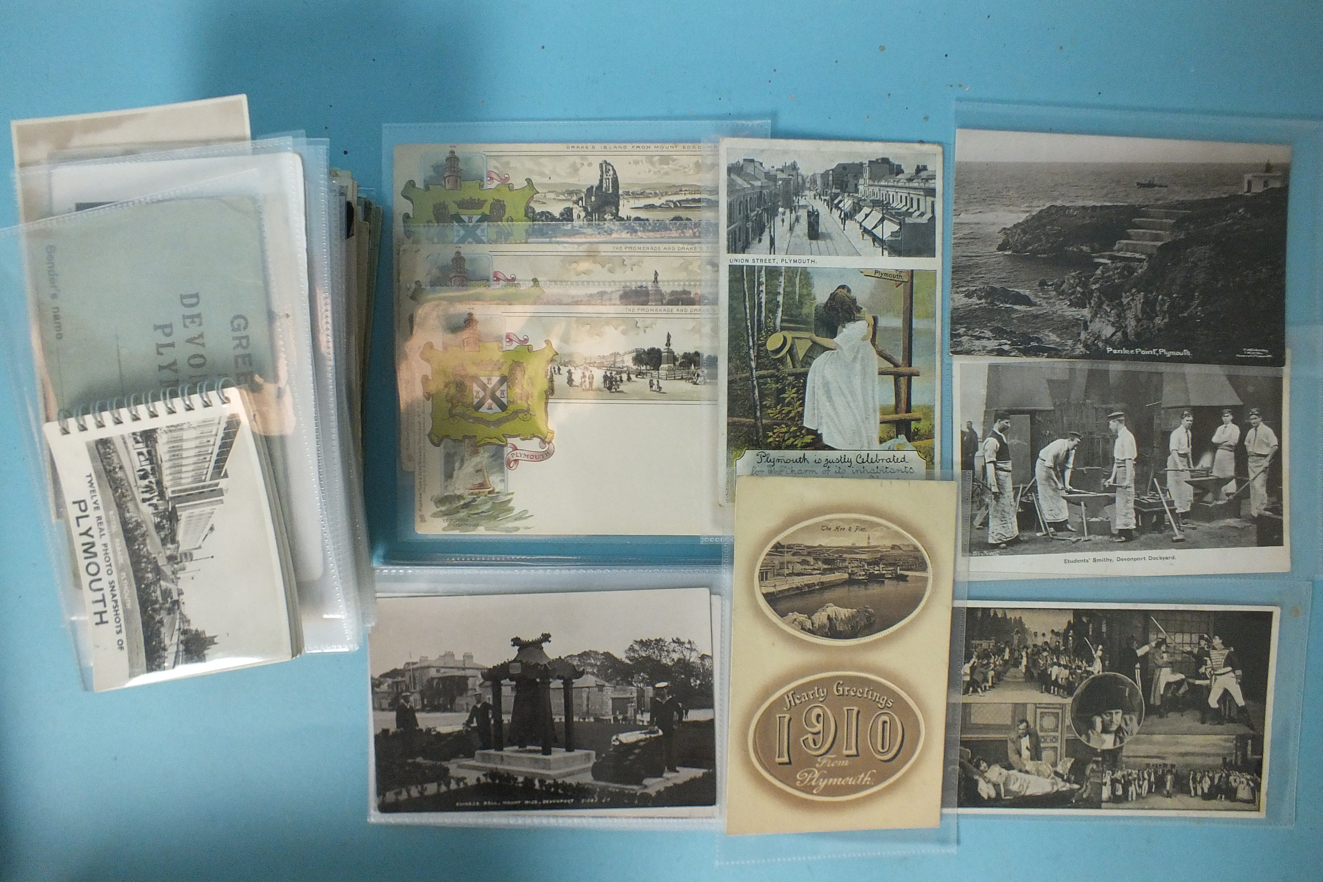 Approximately 250 postcards of Plymouth, including RPs, three Raphael Tuck Heraldic cards, etc.